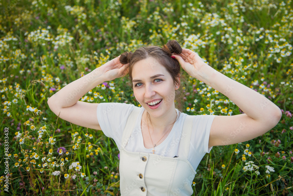 Happy woman in nature. A woman in a field with chamomile's. Happy woman in nature. A woman in a field with chamomile's.