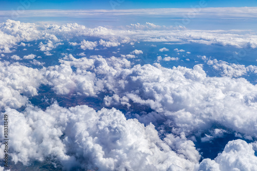 Clouds and sky as seen through window of an aircraft. © ABCDstock