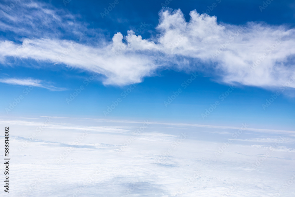 Clouds and sky as seen through window of an aircraft. Clouds and sky as seen through window of an aircraft.