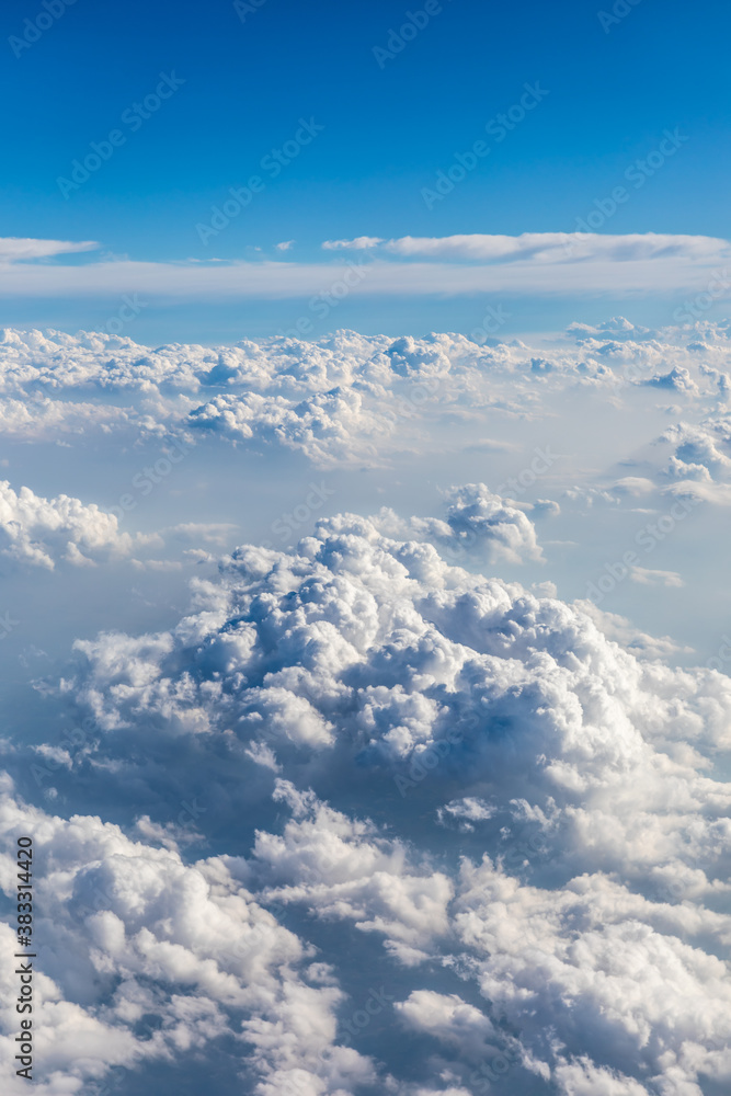 Clouds and sky as seen through window of an aircraft. Clouds and sky as seen through window of an aircraft.