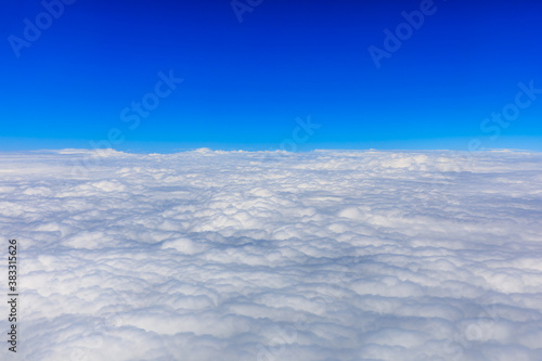 Clouds and sky as seen through window of an aircraft. © ABCDstock