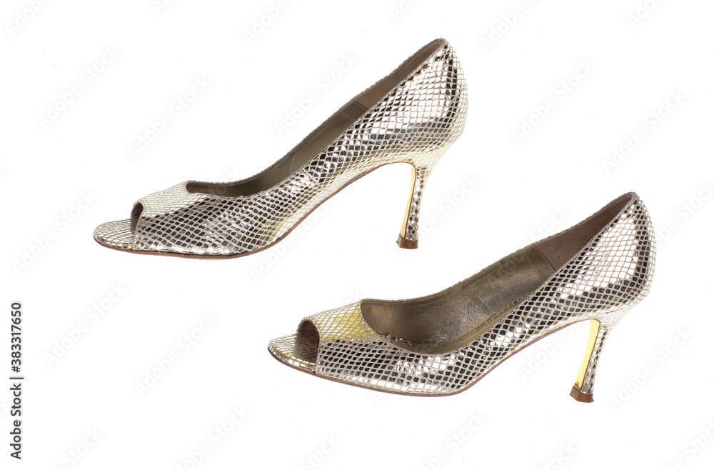 Obraz premium silver high-heeled shoes isolated on white background