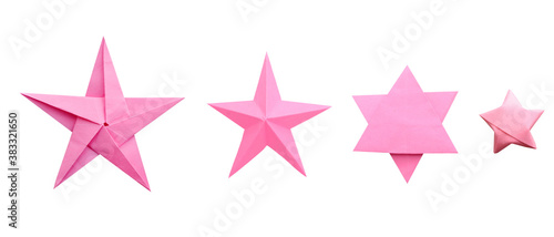 Pink origami paper stars isolated white