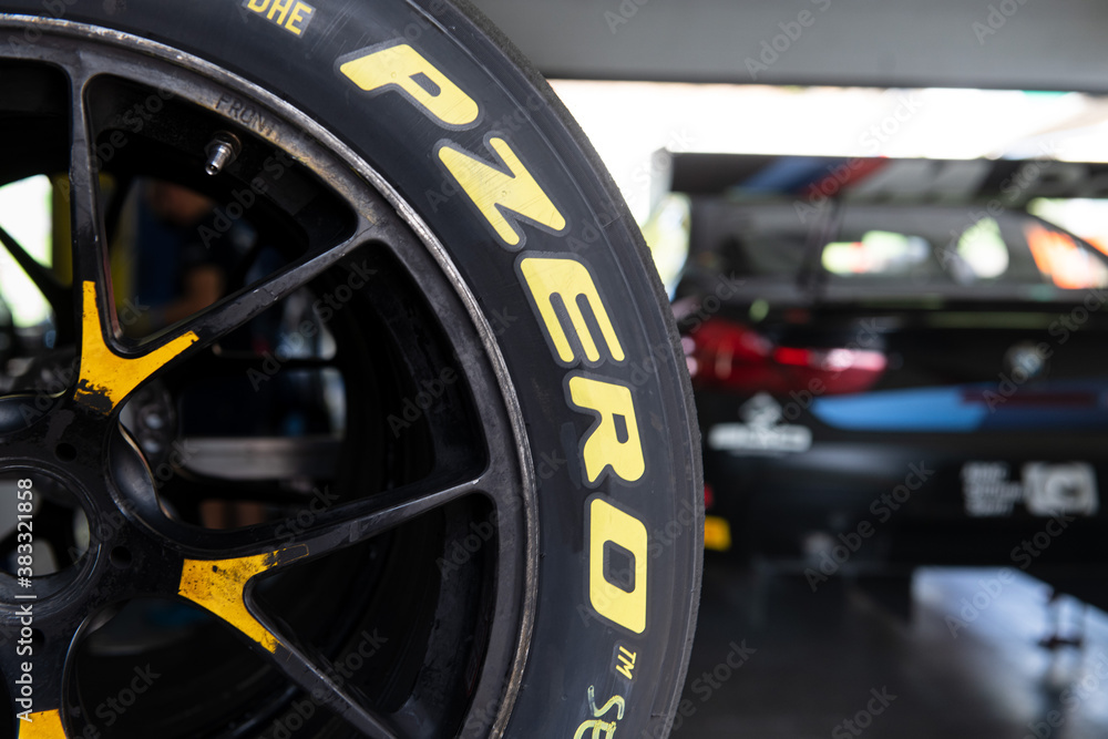 Focus on Pirelli P Zero racing car motorsport tire model, defocused car in  background Stock Photo | Adobe Stock
