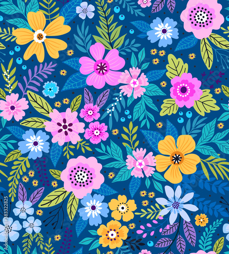 Trendy seamless vector floral pattern. Seamless print made of small multicolored flowers. Summer and spring motifs. Blue background. Vector illustration