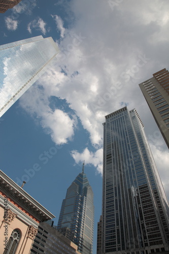 Bottom up view of Philadelphia skyscraper and reflection in glass in downtown Philadelphia  Pennsylvania  USA 
