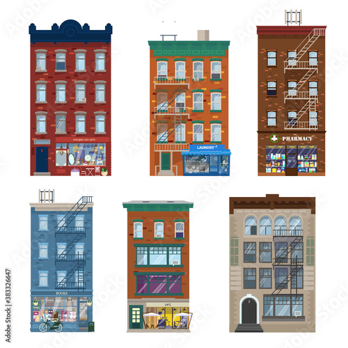 Vector set of different city buildings in Manhattan style with shops, stares, decoration elements. Shop fronts in living brick buildings. Pharmacy, gifts and antiques, laundry, cafe, book shop. Flat.