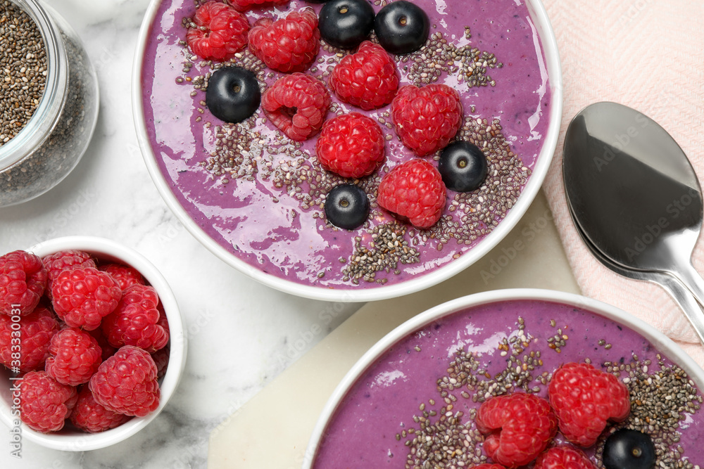 Delicious acai smoothie with fruits served on white marble table, flat lay Delicious acai smoothie with fruits served on white marble table, flat lay