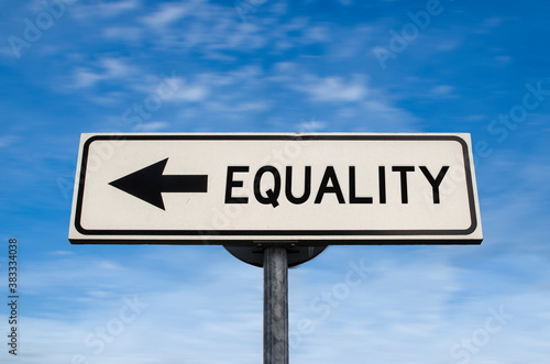 Equality road sign, arrow on blue sky background. One way blank road sign with copy space. Arrow on a pole pointing in one direction.
