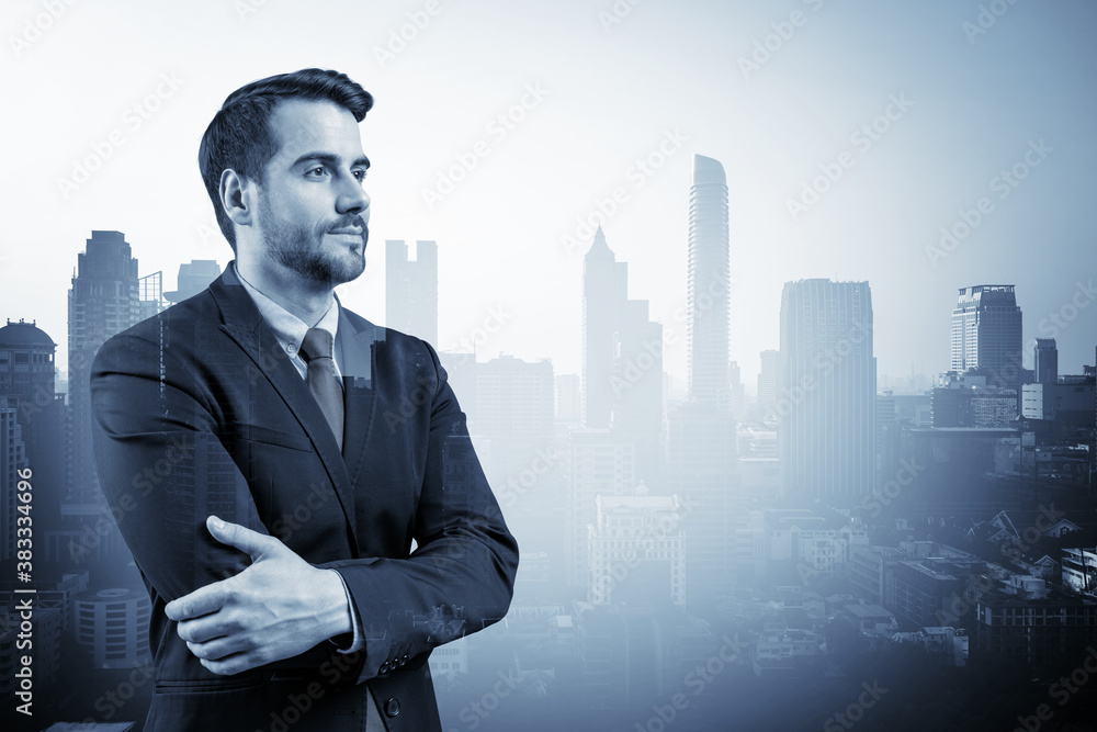 Prosperous European entrepreneur in suit in crossed arms pose. Bangkok cityscape. The concept of problem solving. Financial downtown. Double exposure. Prosperous European entrepreneur in suit in crossed arms pose. Bangkok cityscape. The concept of problem solving. Financial downtown. Double exposure.
