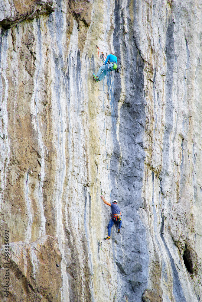 Fototapeta premium Climbers on a big limestone wall