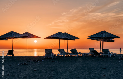 Beach umbrellas at sunrise