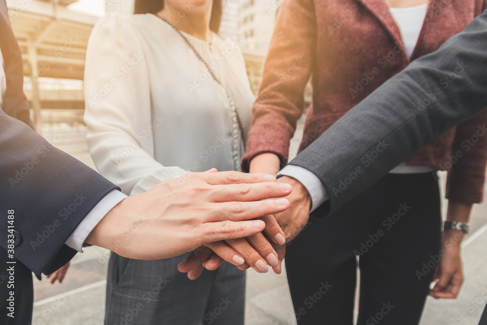 Business people shaking hands, putting their hands together, finishing up meeting. Deal Successful Business people shaking hands, putting their hands together, finishing up meeting. Deal Successful