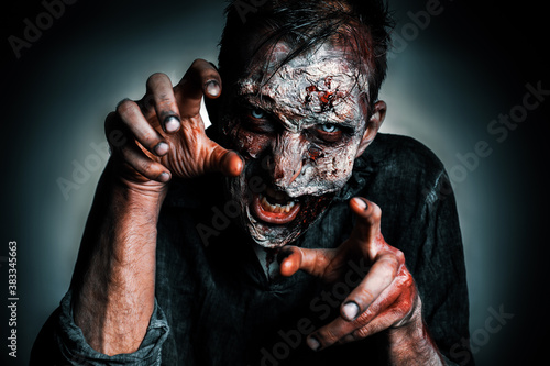 Bilde på lerret Scary zombie on dark background. Halloween monster