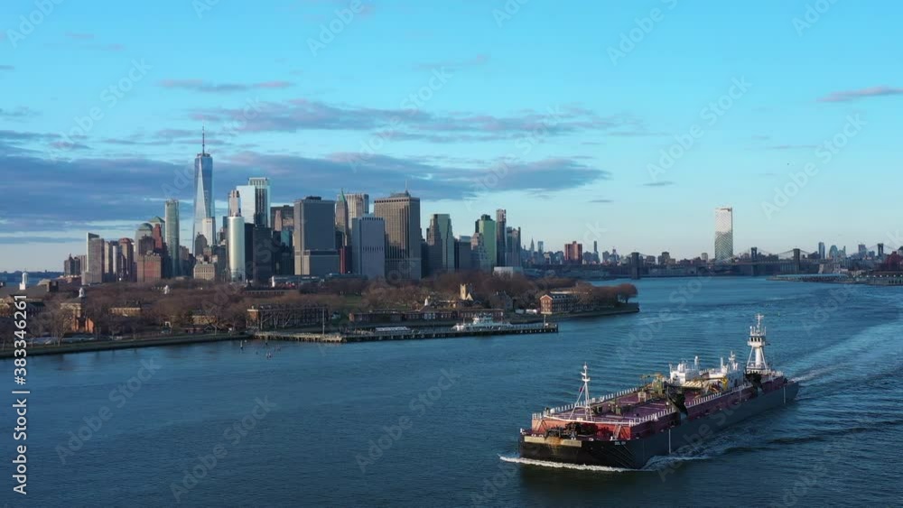 Receding rising fly-away aerial of freedom tower skyline and governors island Receding rising fly-away aerial of freedom tower skyline and governors island