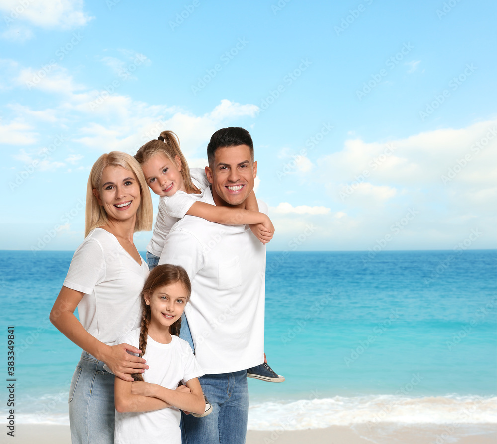 Happy family on sandy beach near sea. Summer vacation