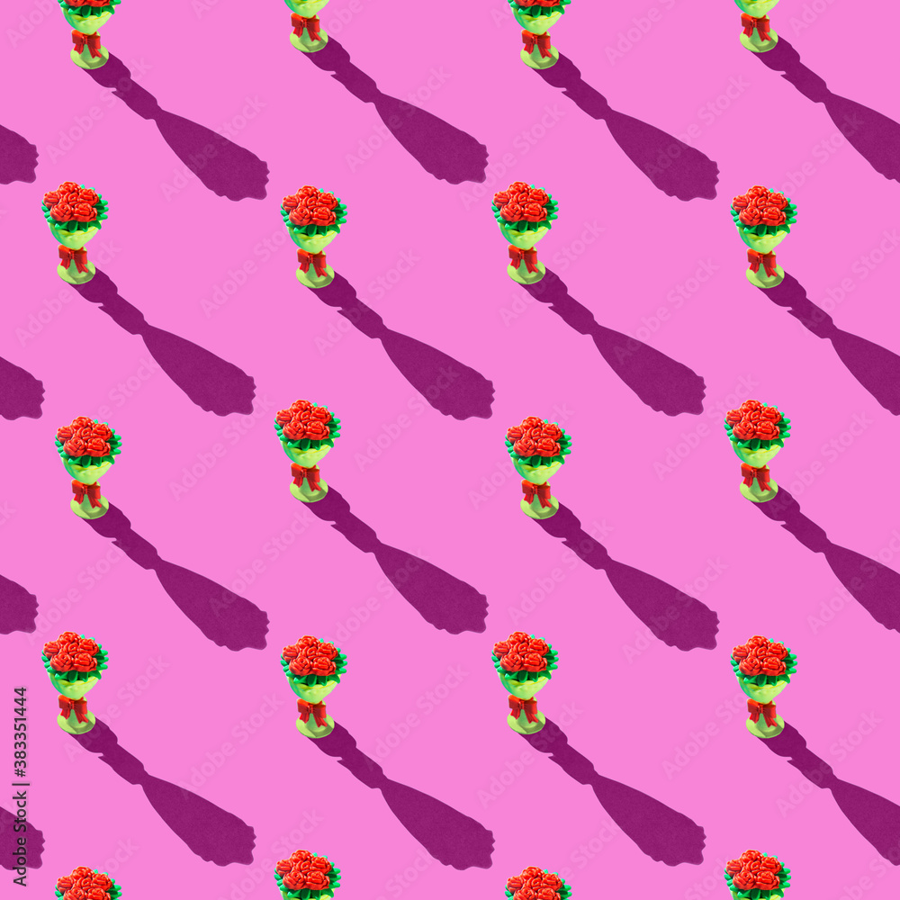 Fototapeta premium Photo seamless pattern red flowers in a yellow bouquet are arranged vertically with shadows on a colored pink background. High quality photo