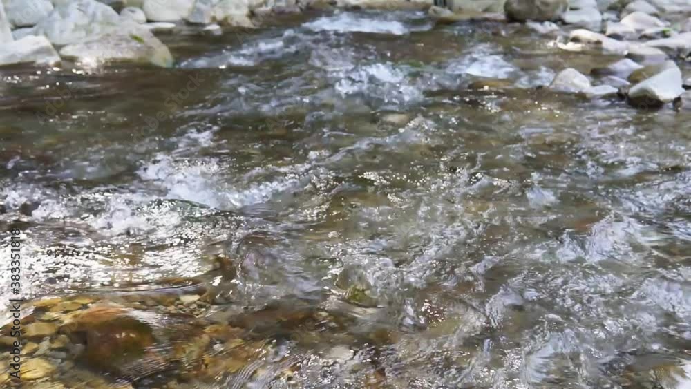stones and mountain river with small waterfall, blurred background. selective focus stones and mountain river with small waterfall, blurred background. selective focus