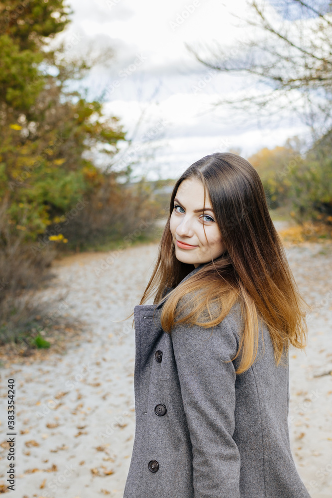 Portrait of a beautiful woman in autumn at the beach. Portrait of a beautiful woman in autumn at the beach.