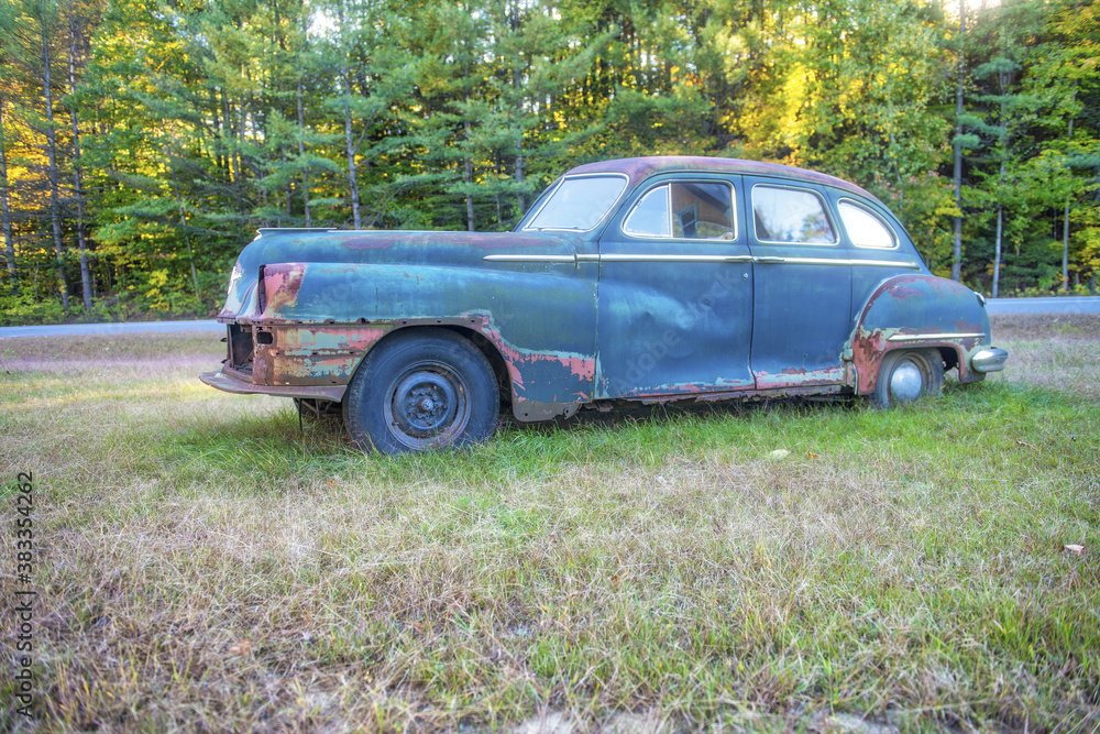 Vintage Car wreckage abandoned in the countryside