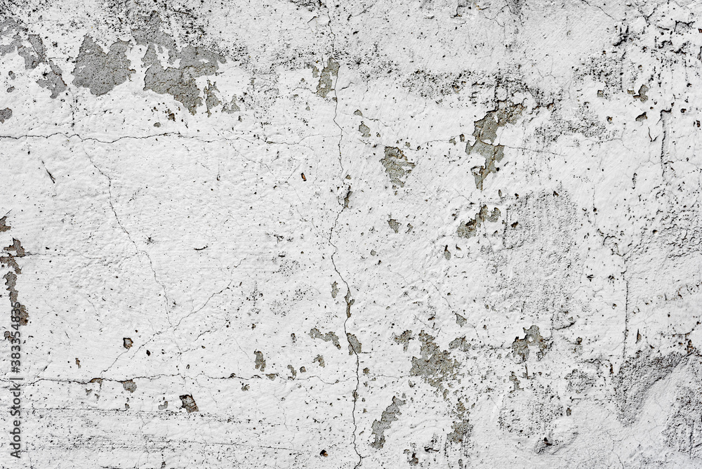 Texture of a concrete wall with cracks and scratches which can be used as a background Texture of a concrete wall with cracks and scratches which can be used as a background