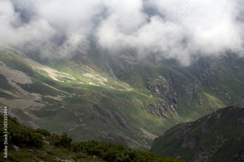 Alpine valley in the clouds. Kabardino-Balkarian natural reserve. Caucasus, Russia.