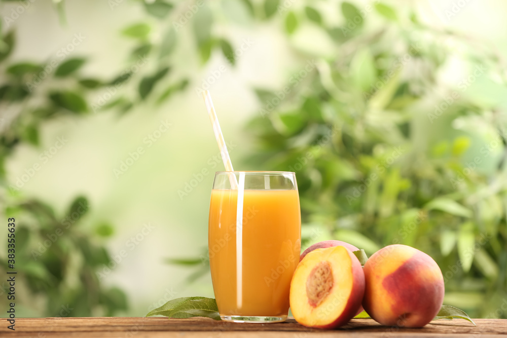 Fototapeta premium Natural peach juice and fresh fruits on wooden table. Space for text