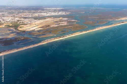 aerial of Faro with harbor and beach