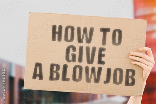 Tableau sur toile Hand holding cardboard sign with text how to give a blow job