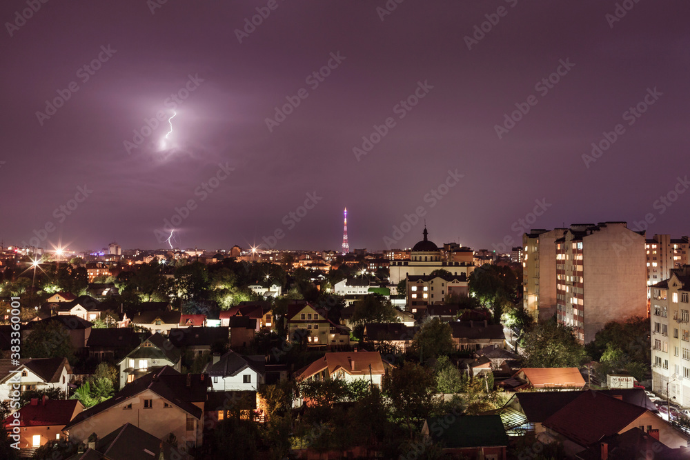 Evening city by storm with thunder and lightning