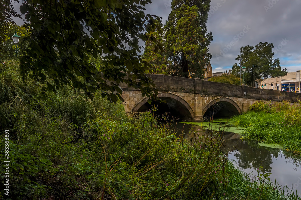 A view towards the bridge over the River Eye in Melton Mowbray, Leicestershire, UK in the summertime