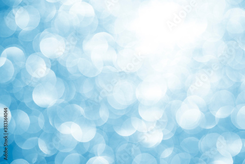 blue white glittering Christmas lights. Blurred abstract background
