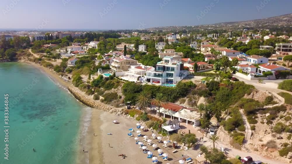 Villas on the sandy beach in summer on the blue sea - a beachfront bay in the ocean with blue water and sandy beach Villas on the sandy beach in summer on the blue sea - a beachfront bay in the ocean with blue water and sandy beach