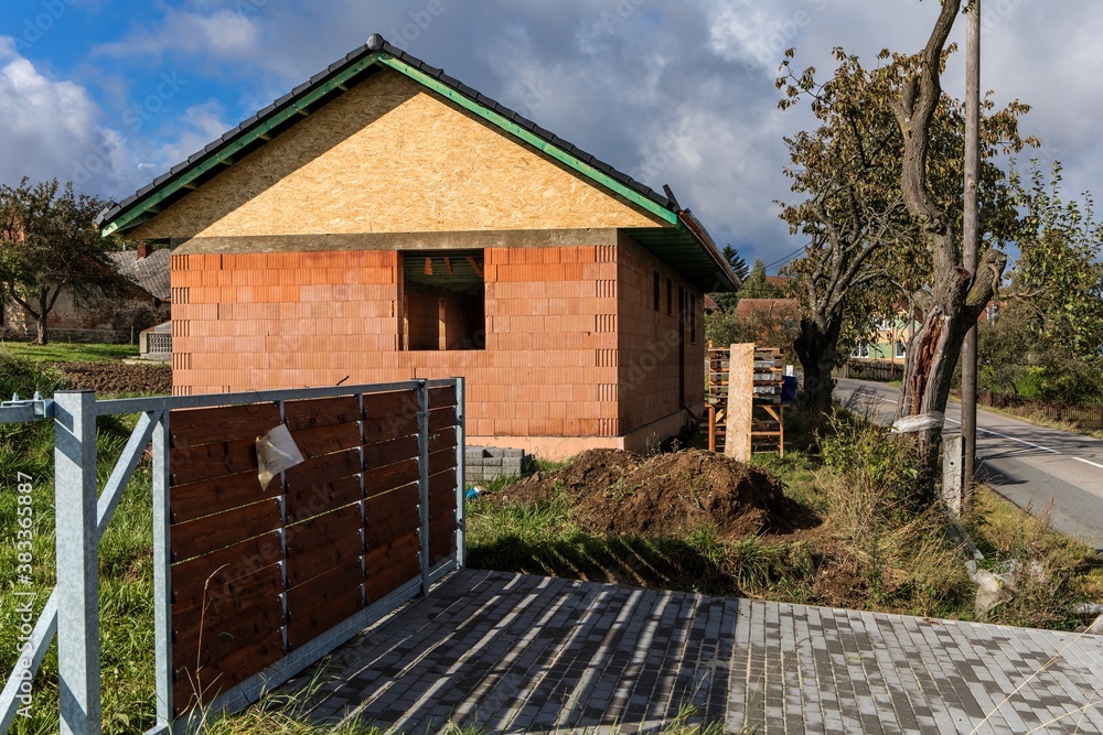 Construction site of a brick family house in the Czech countryside. House construction. Brick house. Construction site of a brick family house in the Czech countryside. House construction. Brick house.