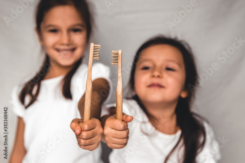 little girl hold eco brushes. the future generation is thinking about the future PNOV2019