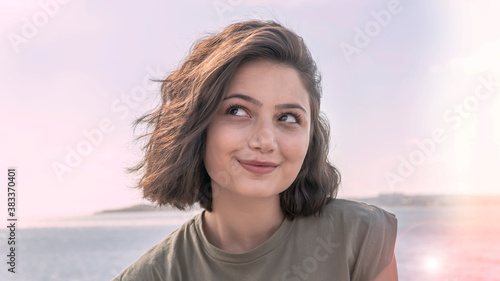 Portrait of smiling charming young woman with happy face.