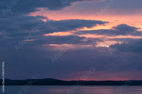ZADAR, CROATIA, OCTOBER, 2020 - Beautiful sunset above the Adriatic sea, the island of Ugljan photographed from Diklo, Zadar, Croatia