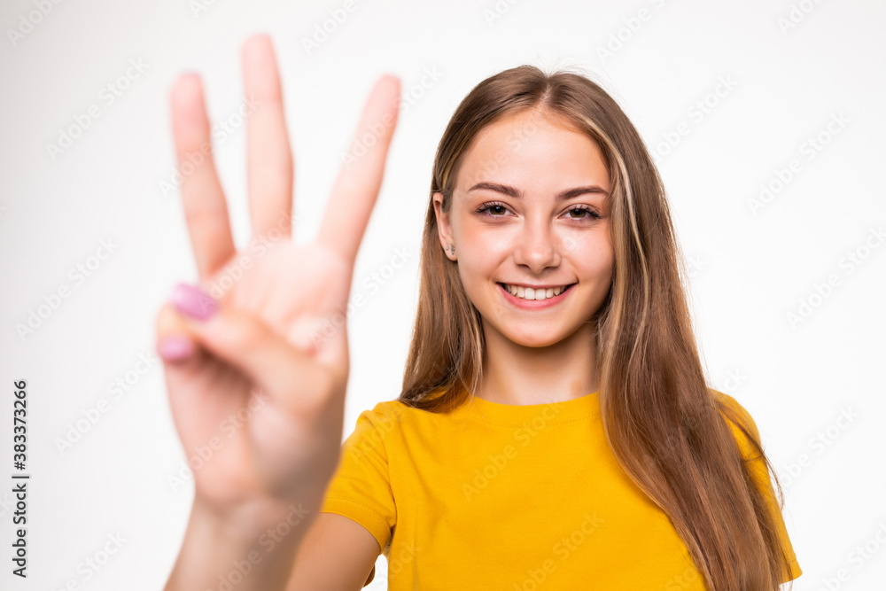Young woman showing number three on white background Young woman showing number three on white background