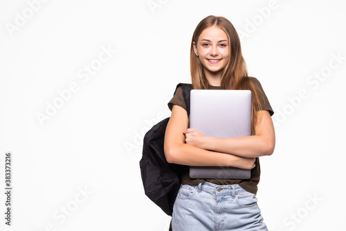 Smiling student holding laptop and looking at camera isolated on a white background
