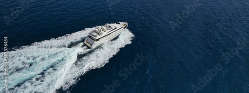 Aerial drone ultra wide photo of yacht sailing in deep blue open ocean sea © aerial-drone