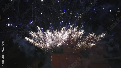 Bright firework display at night, wide aerial