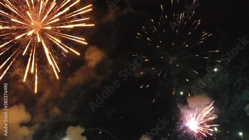 Colorful nighttime firework display in Utah, wide aerial