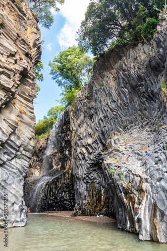 Basalt rocks and pristine water of Alcantara gorges in Sicily, Italy photo