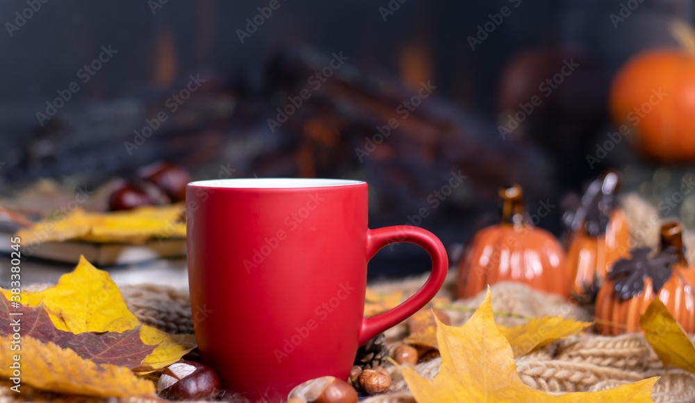 Red mug with tea on the background of a soft, knitted scarf, autumn leaves, pumpkin. Autumn background, cozy evening, fireplace.
Red mug with tea on the background of a soft, knitted scarf, autumn leaves, pumpkin. Autumn background, cozy evening, fireplace.