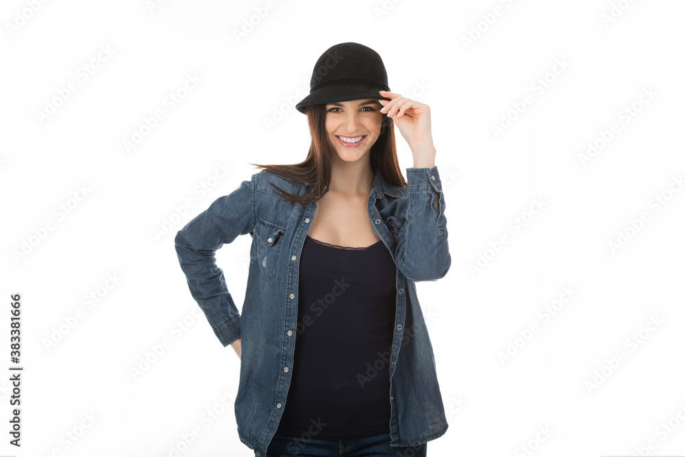 Cute teenage girl touching her black hat in sign of salute Cute teenage girl touching her black hat in sign of salute