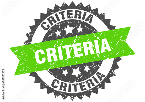 criteria stamp. grunge round sign with ribbon