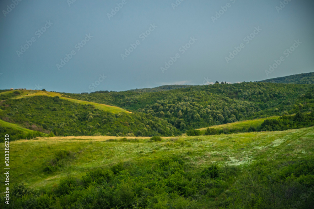landscape with green hills and sky