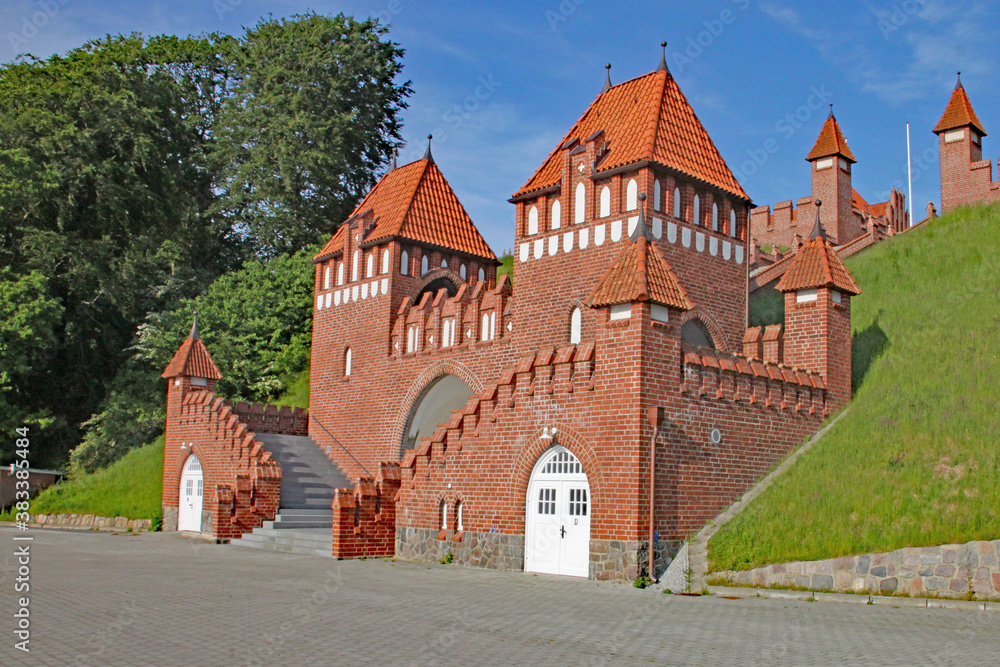 A gatehouse with steps leading up to a fortified area