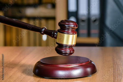 Wooden gavel for judges close-up. Judgment of judgment concept of punishment and pardon. Symbol of law is the hammer of judge.