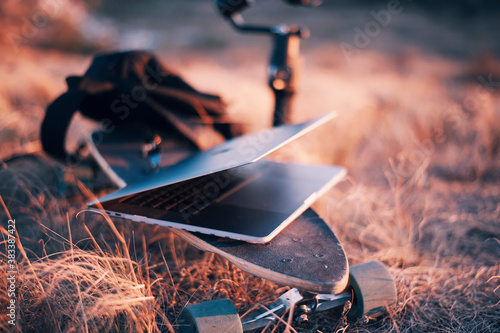 Laptop and Backpack on skate near the camera stabilisator  photo